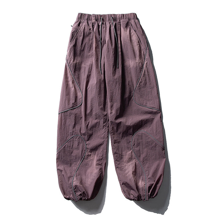Men's loose utility harem pants made of ripstop with drawstring waistband, shaped panels, and elastic ankle cuffs Amarae