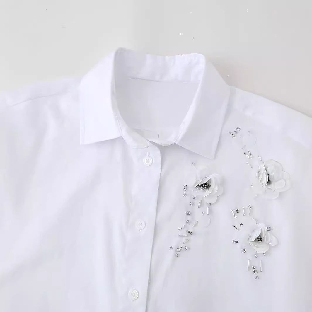 Blouse expertly designed for women with chic floral appliqués and style