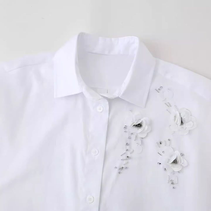 Blouse expertly designed for women with chic floral appliqués and style