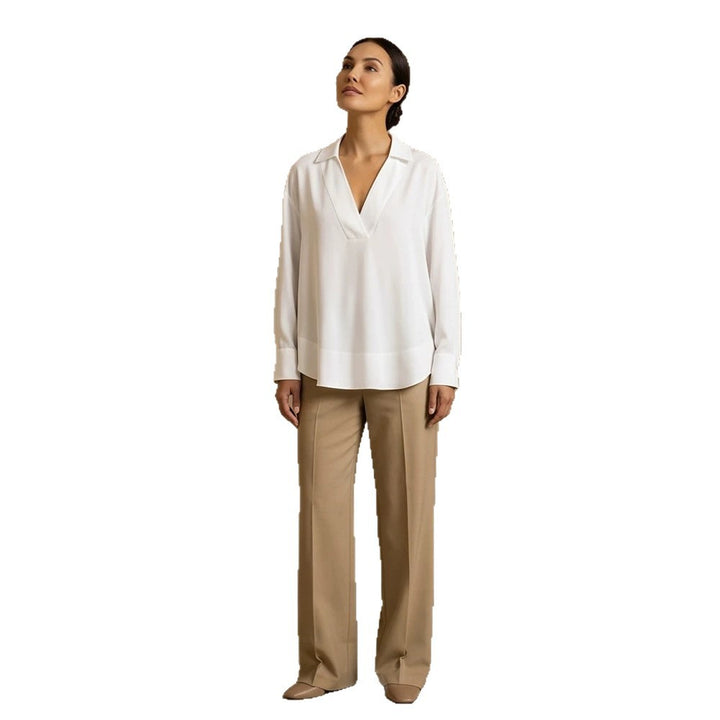 Women's loose-fitting tunic blouse with V-neck, shirt collar, and extended back hem Amarae