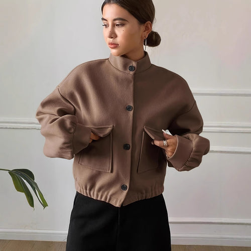 Fashionable short jacket for women with practical flap pockets and a chic stand-up collar