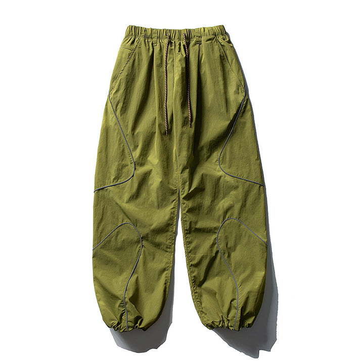 Men's loose utility harem pants made of ripstop with drawstring waistband, shaped panels, and elastic ankle cuffs Amarae