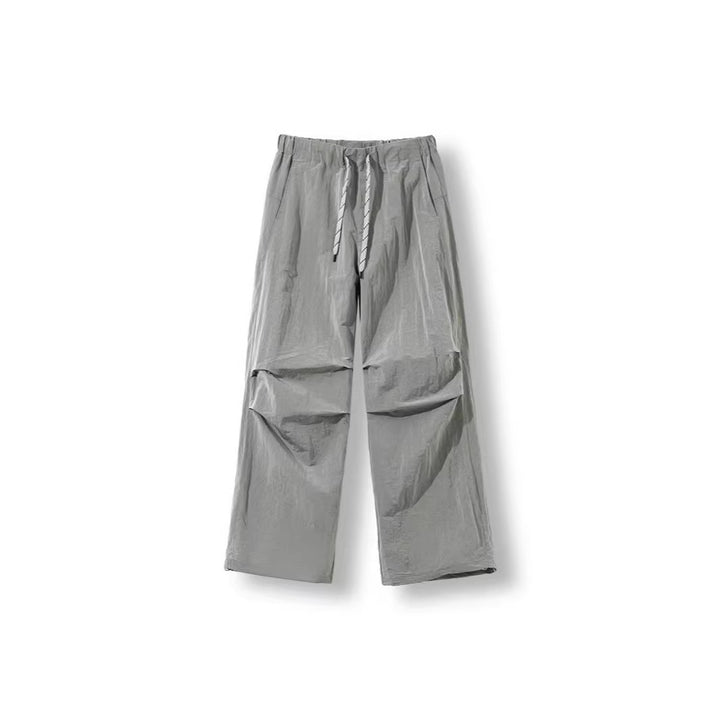 Men's loose-fitting nylon track pants with drawstring, patch pockets, and straight wide-leg fit Amarae
