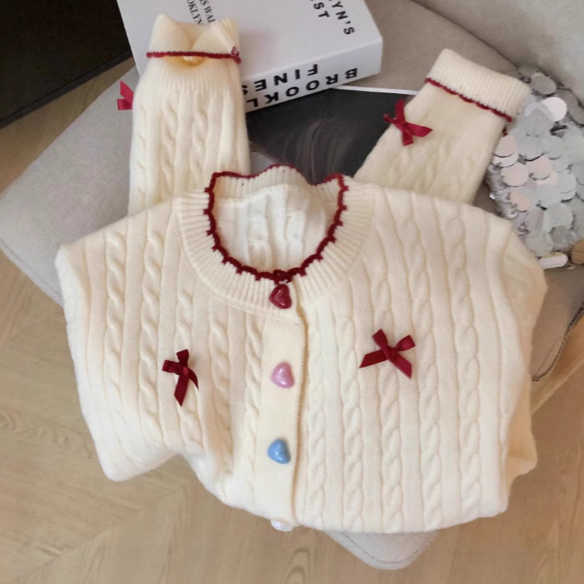 Knitted jacket for women with a playful cable pattern and colorful button details Lune London