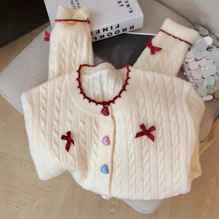 Knitted jacket for women with a playful cable pattern and colorful button details Lune London