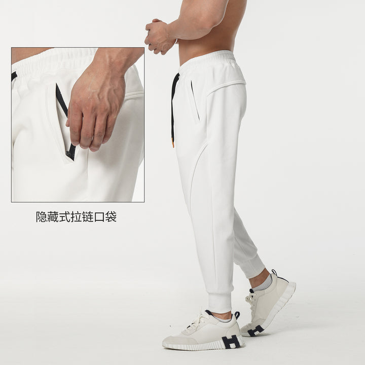 Sporty jogger pants for men with elastic waistband and stylish contrasting stripes Lune London