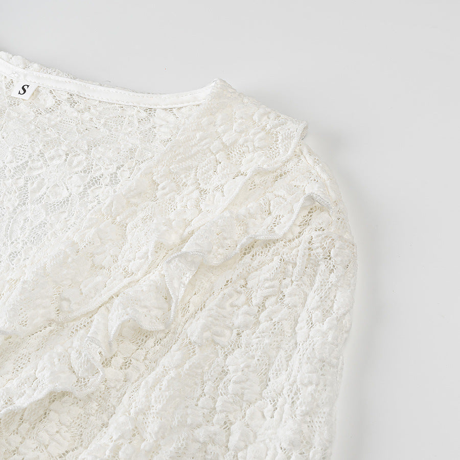 Ladies figure-hugging lace blouse with ruffle V-neck and tie detail Amarae