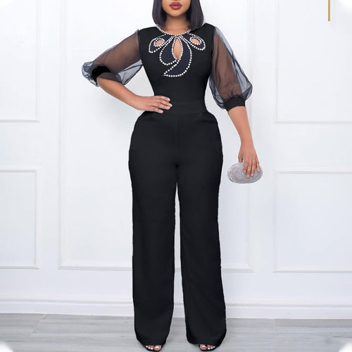 Elegant woman’s jumpsuit with sheer sleeves and pearl embellishment Amarae