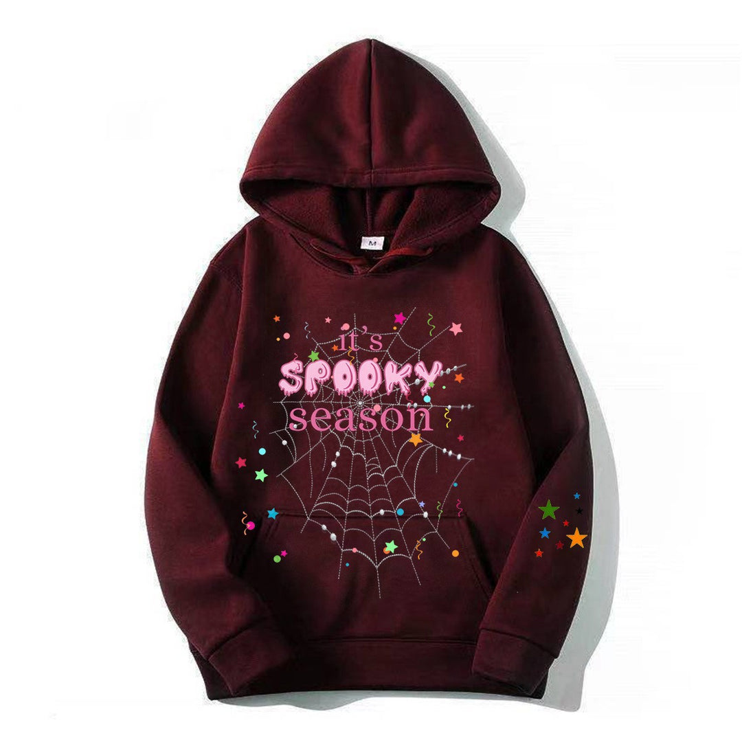 Women cozy hoodie with graphic Halloween design Chic & Stil