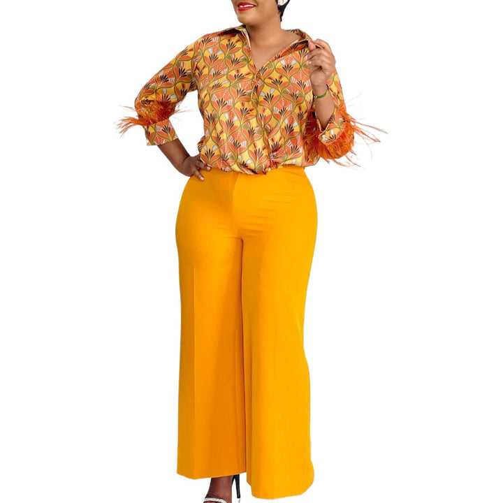 Expressive outfit for women with printed blouse and wide pants Lune London