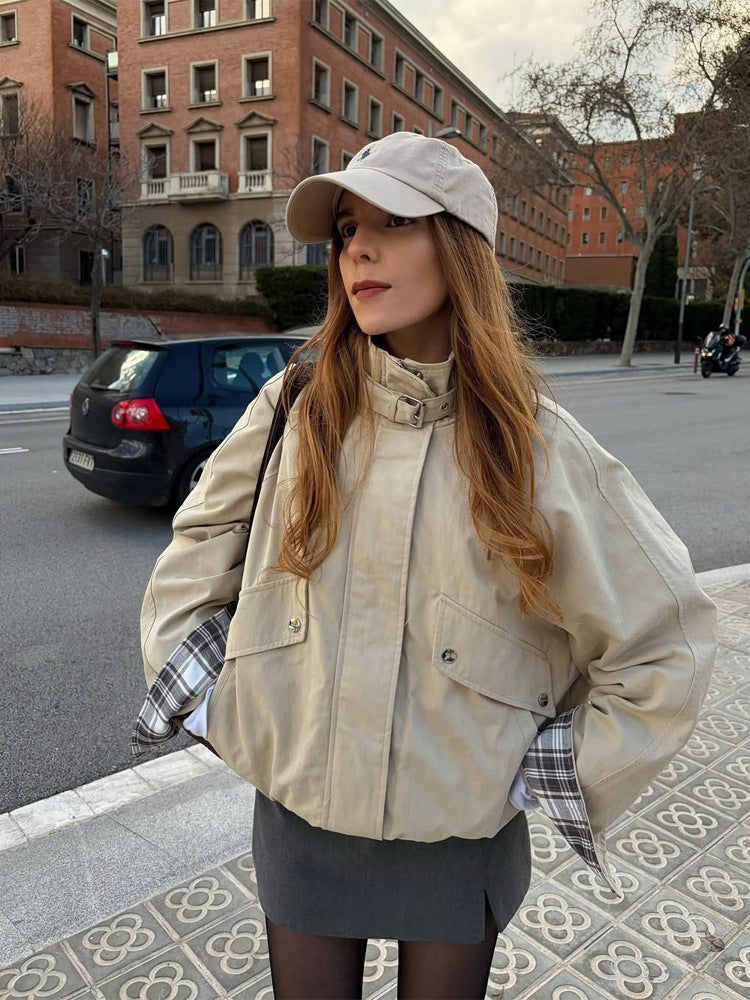 Women’s short bomber jacket with stand-up collar, chin strap, and checkered sleeve lining Amarae