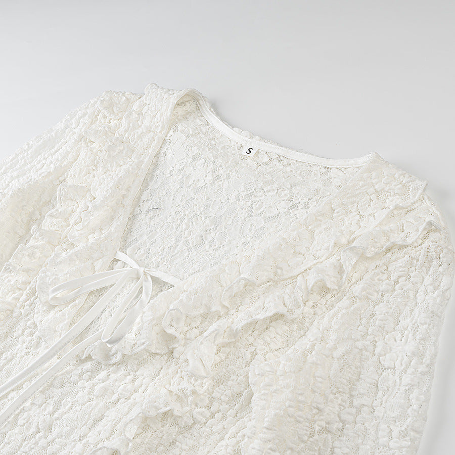 Ladies figure-hugging lace blouse with ruffle V-neck and tie detail Amarae