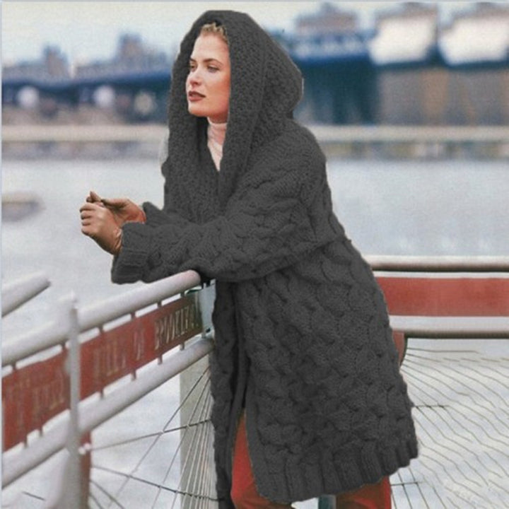 Thick knitted coat for women with hood and decorative cable knit pattern Lune London