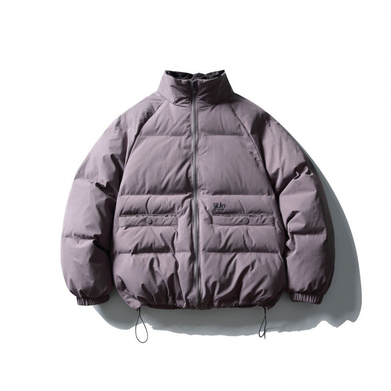 Unisex Boxy padded stand collar puffer jacket with drawstring hem and flap pockets Amarae