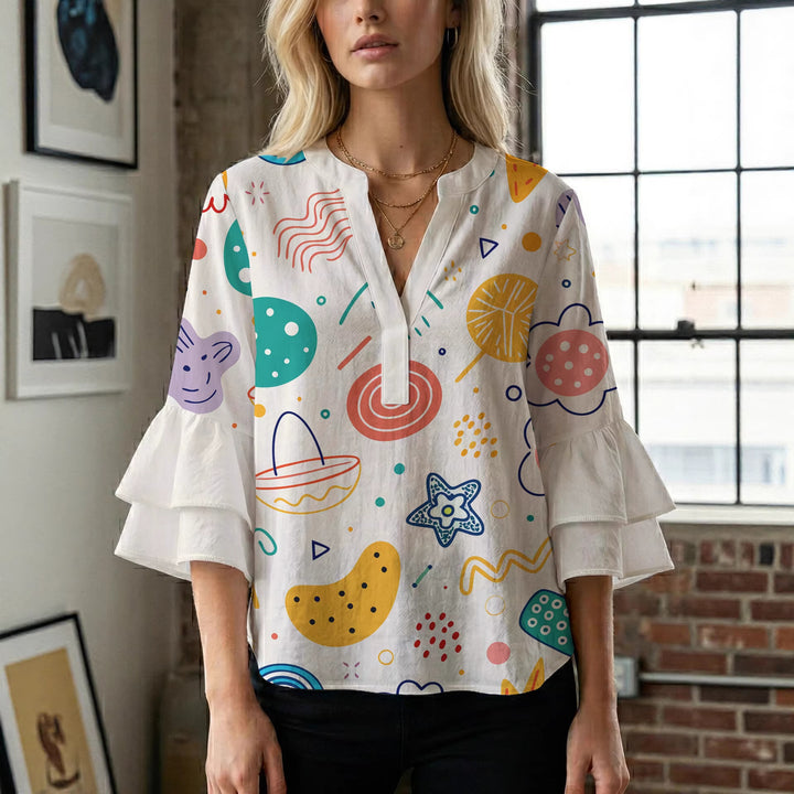 Women’s blouse with voluminous ruffled sleeves and floral pattern Lune London