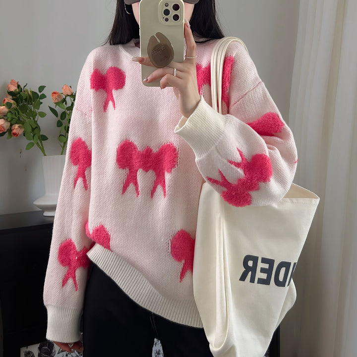 Cozy knitted sweater for women with playful bow pattern Lune London