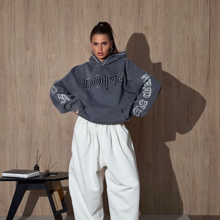 Ladies oversized hoodie with striking stone decoration and creative prints on the sleeves Lune London