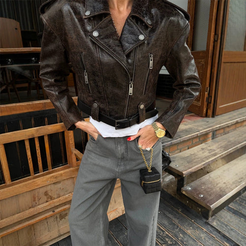 Women short cut biker jacket made of textured faux leather with waist belt Amarae