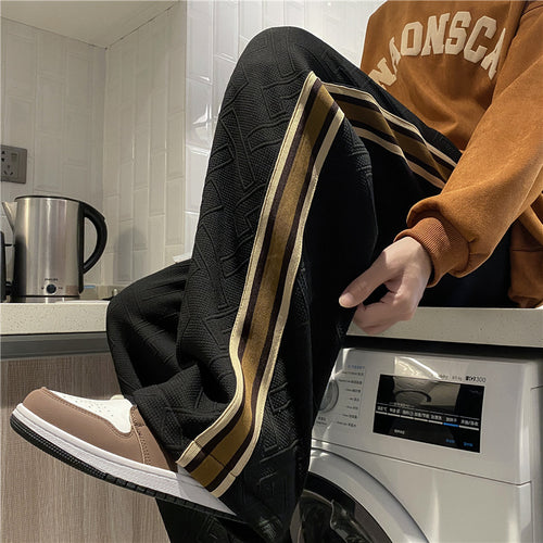 Women's leisure pants with textured design and side stripes Chic & Stil