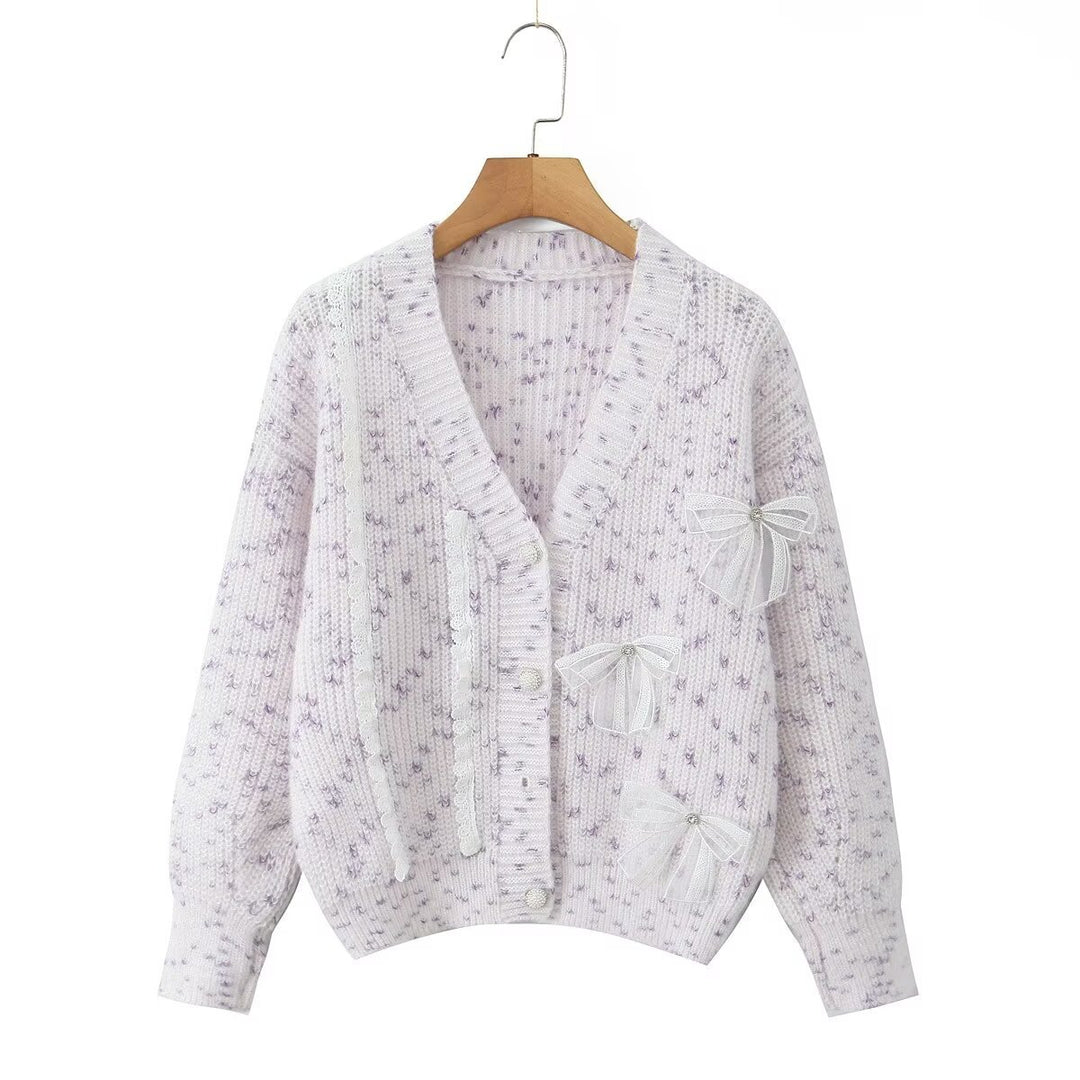 Women's knitted jacket with decorative knots and a delicate pattern Lune London