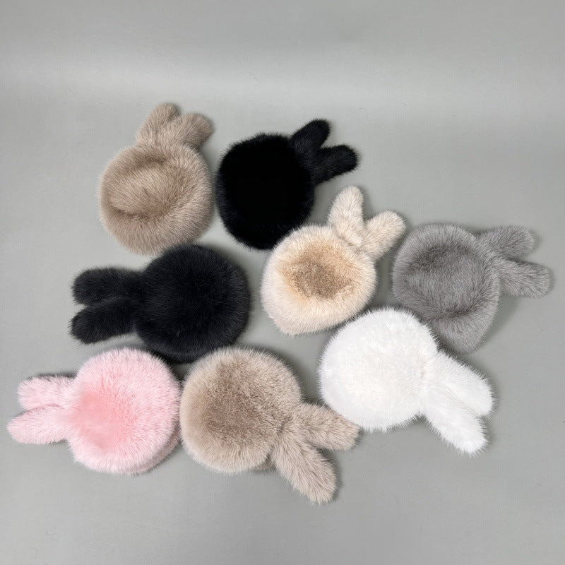 Women’s plush faux fur trapper hat with earflaps and decorative tail Amarae