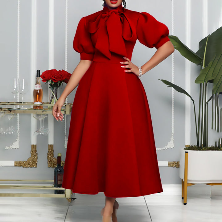 Elegant maxi dress for women with voluminous puff sleeves and a bow neckline Lune London
