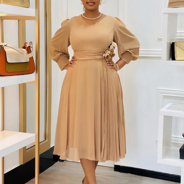 Elegant dress for women with decorative floral accent and draping Lune London