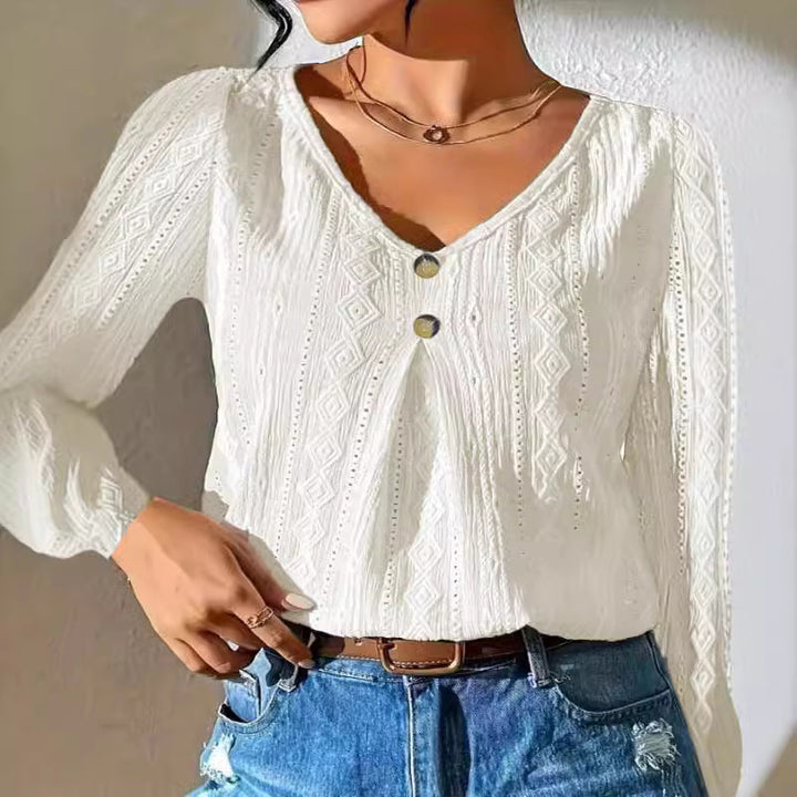Women's blouse with decorative buttons and textured fabric Amarae