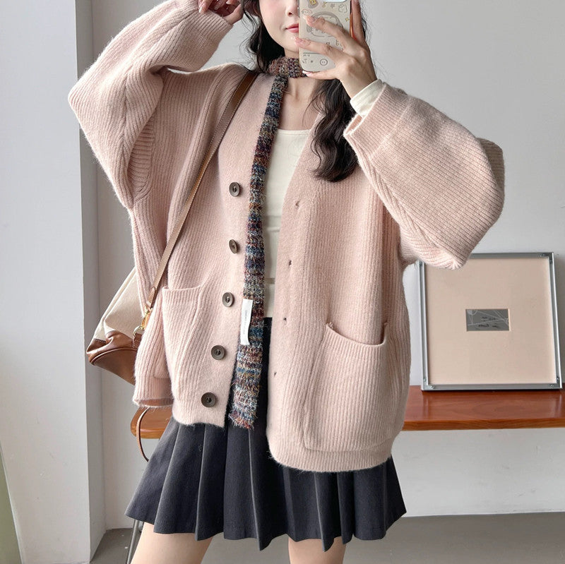 Cardigan en tricot épais pour femmes avec des détails de boutons élégants et des poches pratiques Chic & Stil