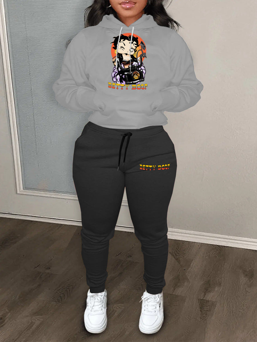 Ladies modern outfit hoodie sweater and casual jogger pants with chic cartoon drawing artistic print