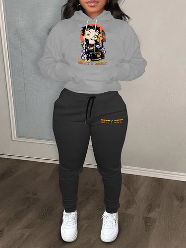 Ladies modern outfit hoodie sweater and casual jogger pants with chic cartoon drawing artistic print