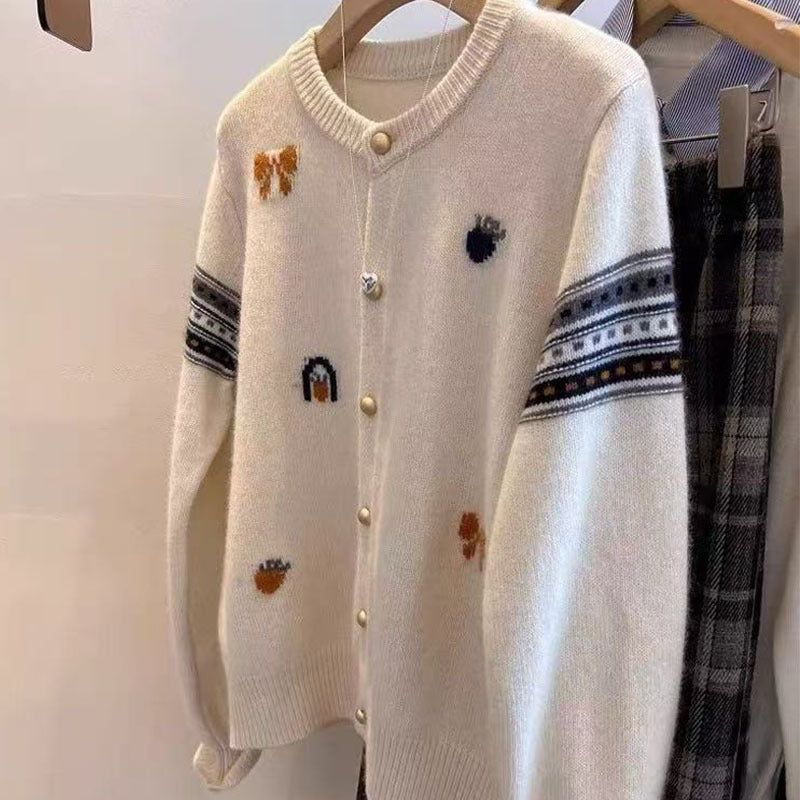 Knitted jacket for women with elegant appliqués and chic and stylish button details