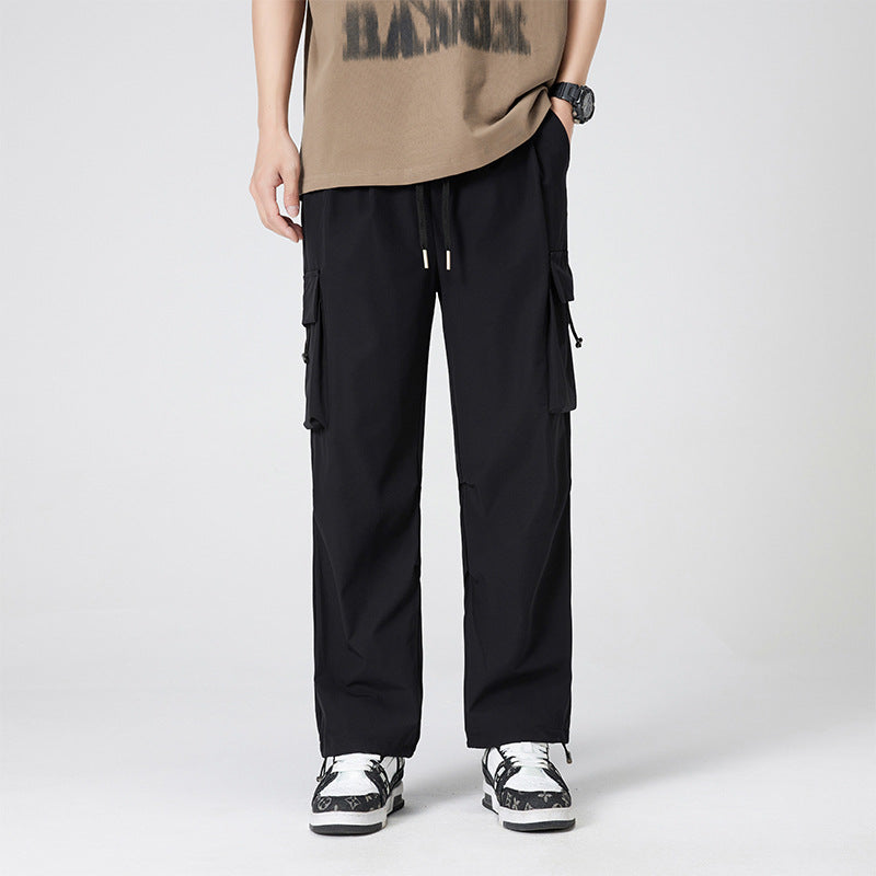 Women’s cargo pants in outdoor style with drawstring waistband, large side pockets, and adjustable hem.