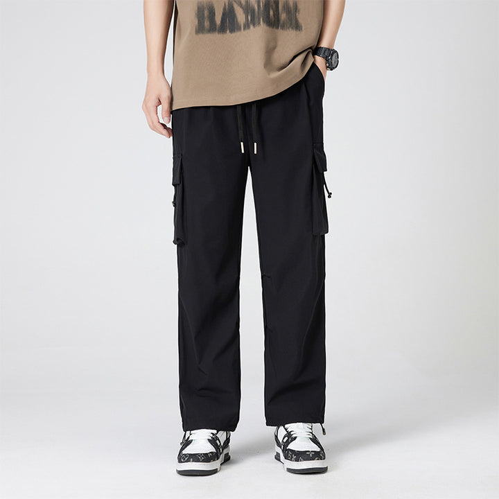 Women’s cargo pants in outdoor style with drawstring waistband, large side pockets, and adjustable hem.