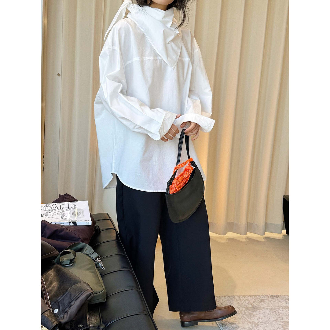 Women loosely cut cotton blouse with wrapped shawl collar and wide cuffs