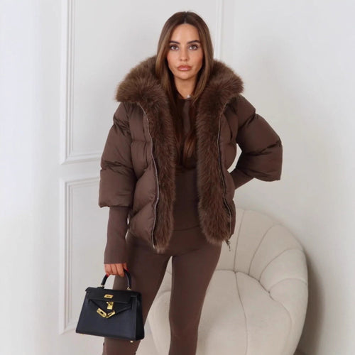 Veste d'hiver pour femmes avec un luxueux col en fausse fourrure et un design matelassé Chic & Stil