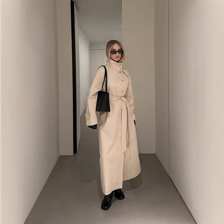 Ladies maxilength trench coat with high stand-up collar, double-breasted button placket and tie belt Amarae