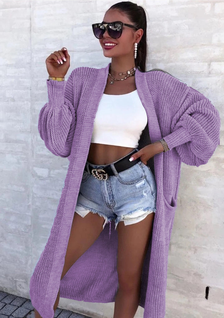 Long knitted coat for women with oversized sleeves and practical pockets Lune London