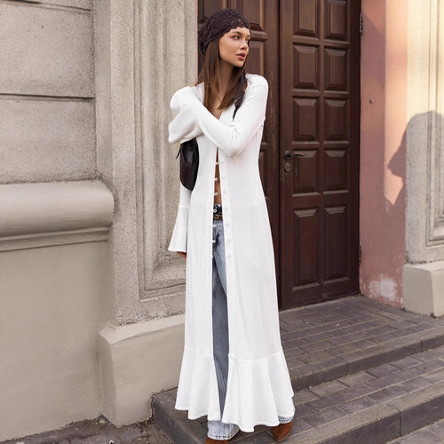 Long knitted coat for women with an elegant cut and a chic button design.