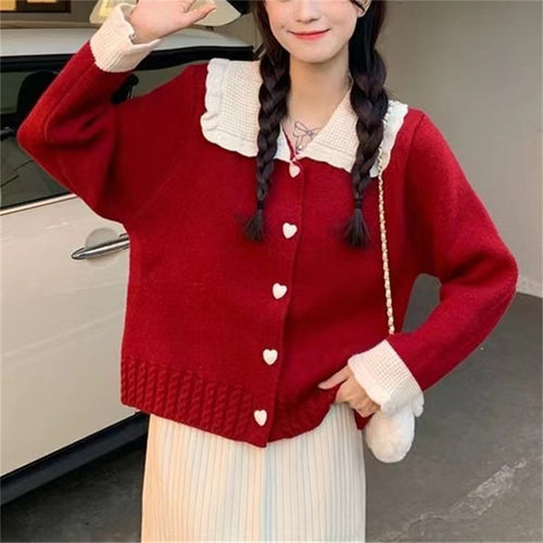Knitted women's jacket with heart-shaped buttons and a distinctive ruffle collar Amarae