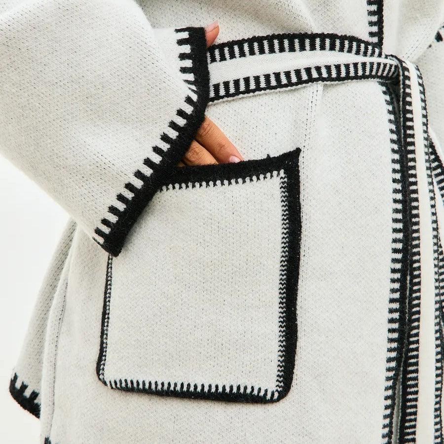 Thick knitted coat for women with practical belt and pockets Lune London