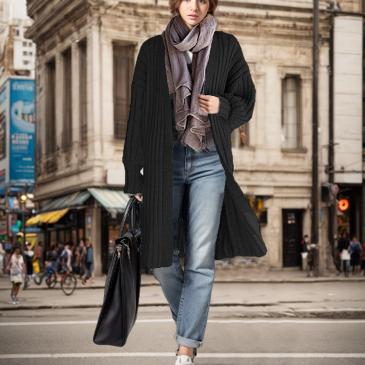 Ladies Long knit coat with elegant ribbed structures and a loose fit Chic and Still