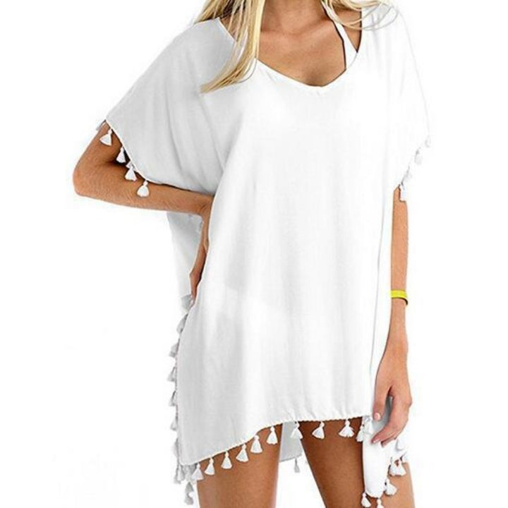 Tuniques de plage pour femmes avec une structure aérienne et des pompons ludiques Chic & Stil