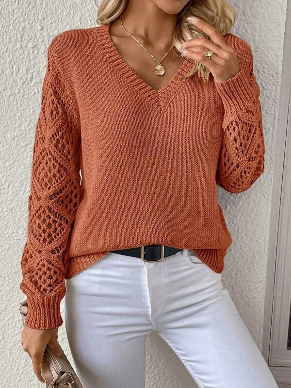 Knitted sweater for women with refined lace sleeves and a chic V-neck