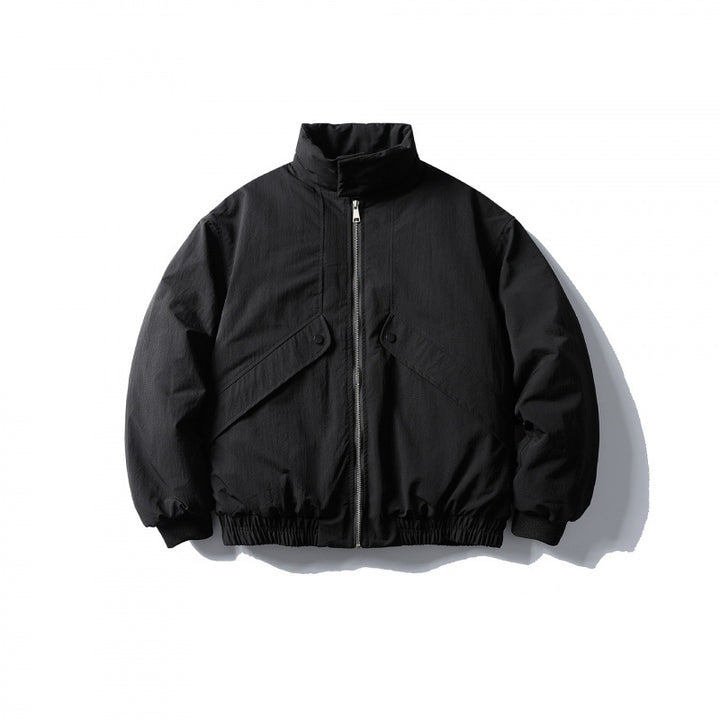 Unisex short boxy isolation jacket with diagonal flap pocket detail and elastic hem Amarae