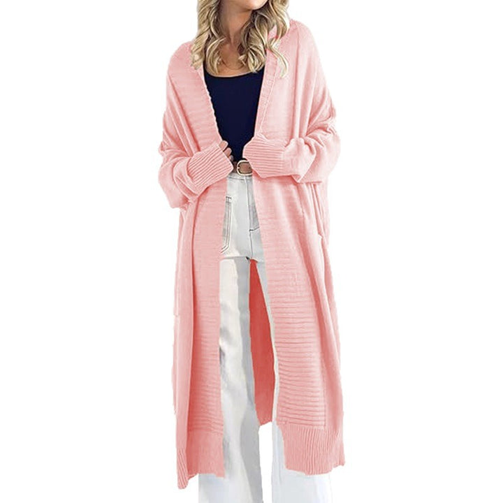 Ladies lightweight knit coat with wide sleeves and practical piped pockets Lune London