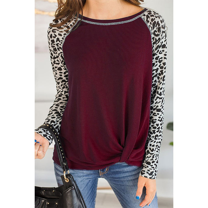 Loose blouse with long sleeves for women with leopard sleeves and bow detail Lune London