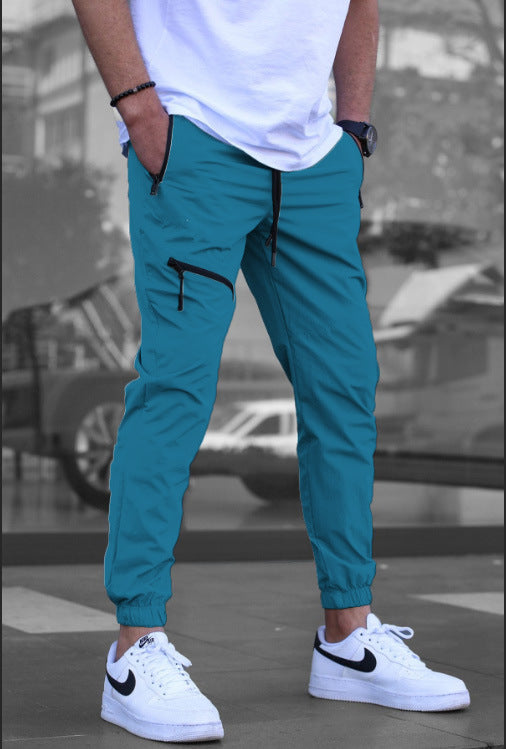 Sport suit trousers for men with elastic waistband and zip pockets on the sides Lune London