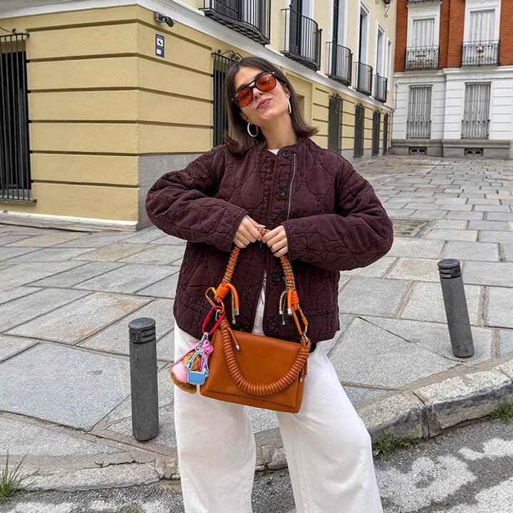 Women's shoulder bag made of synthetic leather with braided handle and spiral-shaped front grip Amarae