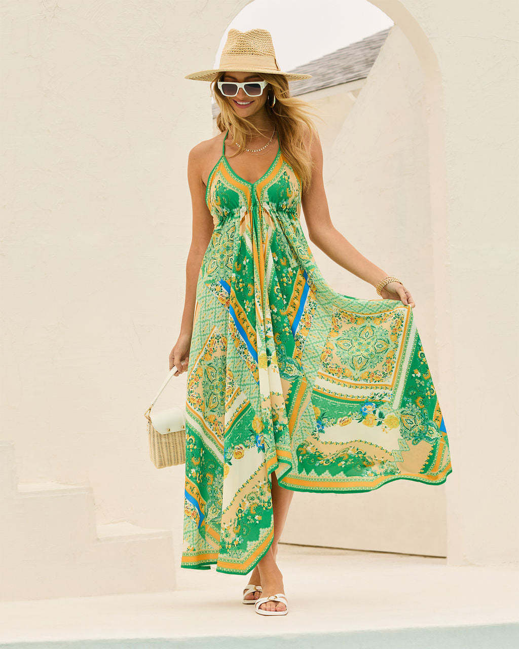 Ladies Airy Maxi Dress with Playful Halterneck Design and Floral Accents Lune London